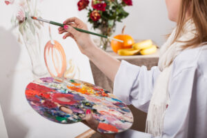 Woman painting - 4 c's of art- Yarnell School