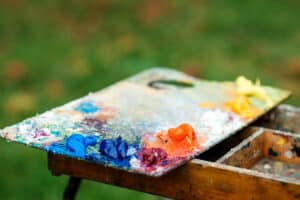 Art palette on nature blurred background. Capturing nature in Acrylic Painting - Yarnell School Online.