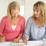 Mid age women painting with watercolors. Yarnell School Online.